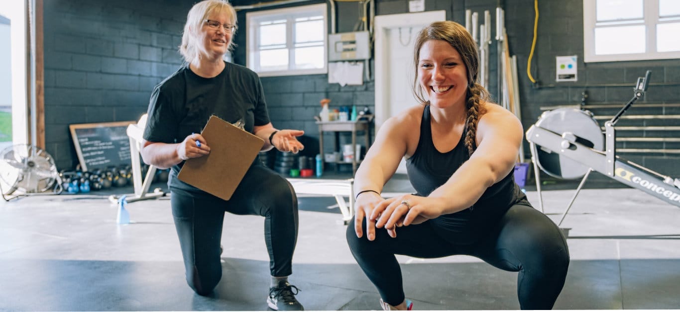 CrossFit NYC athletes pushing through a high-energy workout at Flatiron